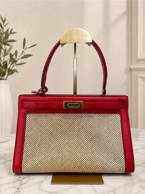 Tory Burch Lee Radziwill bag features a red leather and a woven beige center